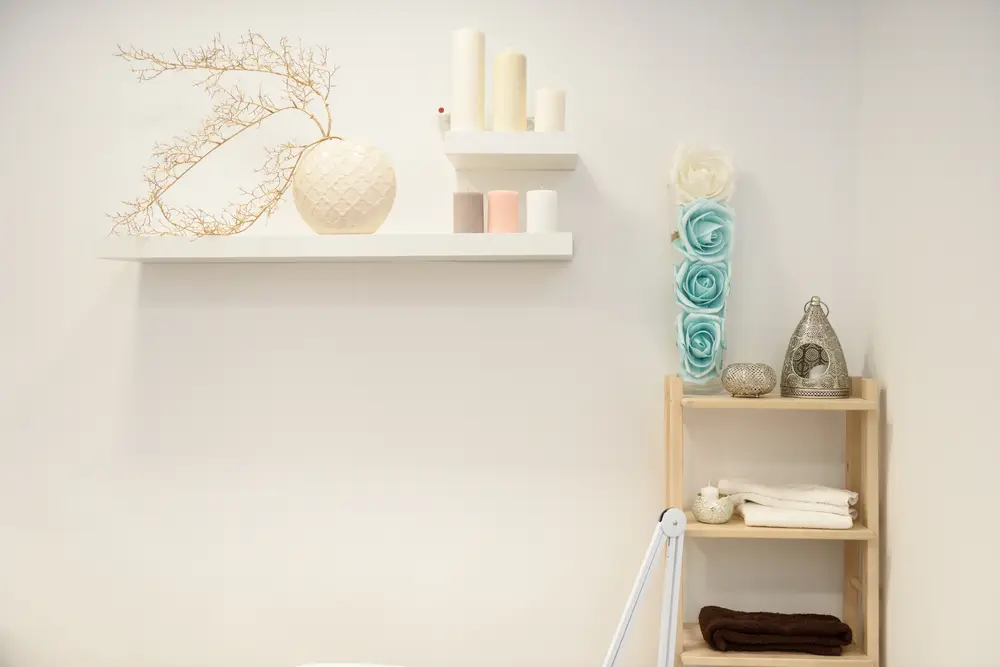 Shelves with candles and flowers in the waiting area