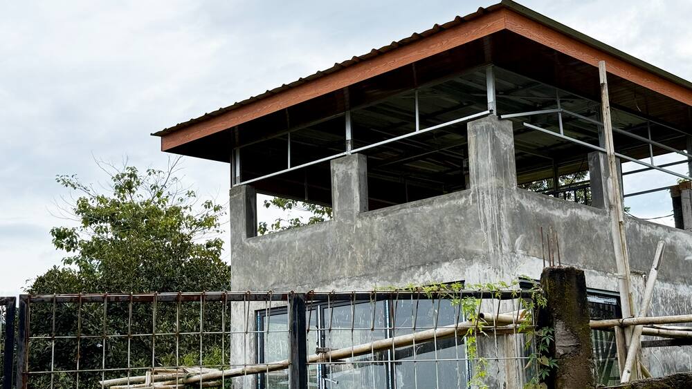 Older concrete building being assessed before an extension
